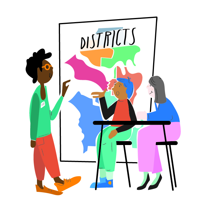 People drawing districts and pointing at district map