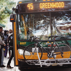 A crowd boarding the 45 Greenwood Metro Bus
