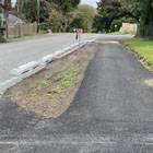 At-grade asphalt walkway