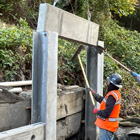Installing the piles for the retaining wall along Perkins Lane 