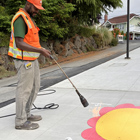 Crew installing a flower decal, designed by Vera Brown