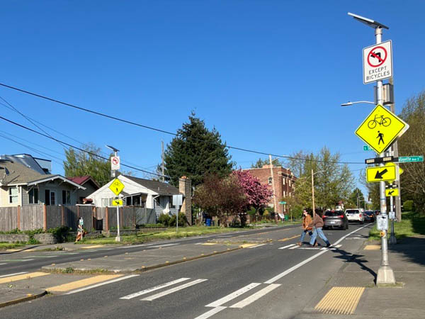 Crosswalks, push buttons, flashing lights, and median islands help people cross the street safely and easily. These are the types of upgrades we’re making on Safe Streets for All projects.    