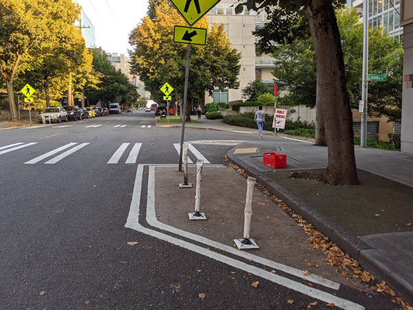 Example of lines on the street that help prevent you from parking too close to an intersection and making it hard for others to see.  