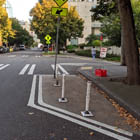Example of lines on the street that help prevent you from parking too close to an intersection and making it hard for others to see.  