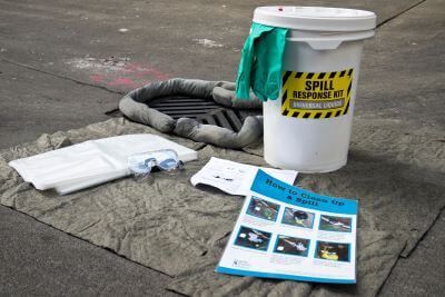 Image shows typical contents of spill kit described on page.