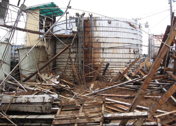 A tank explosion resulted in a discharge of metal hydroxide to the sanitary and storm drain system.