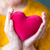 Photo of hands holding heart