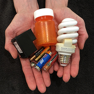 Photo of hands holding recyclables