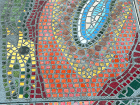 Detail of mosaic artwork in concrete.