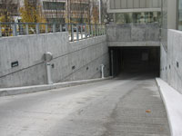 Such surfaces include parking lots, driveways or parking garage entrances and exits.