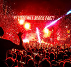 Concertgoers enjoy a live outdoor performance with confetti and lighting effects at Capitol Hill Block Party, 2019.