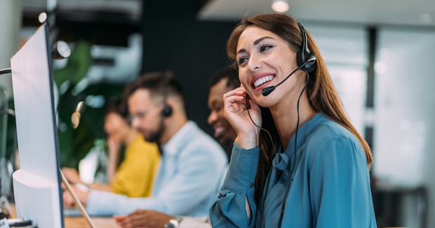 A woman working on a help desk