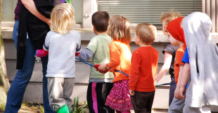 Line of children standing outside