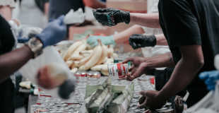 Close image of volunteers serving food