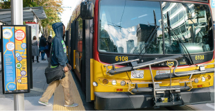 Person getting onboard a city bus