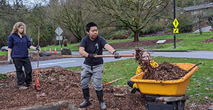 Youth volunteering in a park.