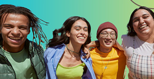 Four diverse youths posing and smiling