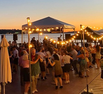 Dancers on a pier at the Seattle waterfront at dusk