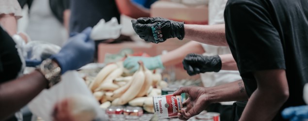 Image of people sorting cans at a foodbank