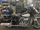 The photo shows a Seattle Police Department Harley Davidson motorcycle, marked with "POLICE."