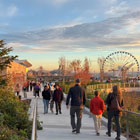 People walking through Bluff Walk pathway close to sunset