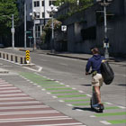 Protected bike lane, signature crosswalk, and expanded sidewalk on Pike Street. 
