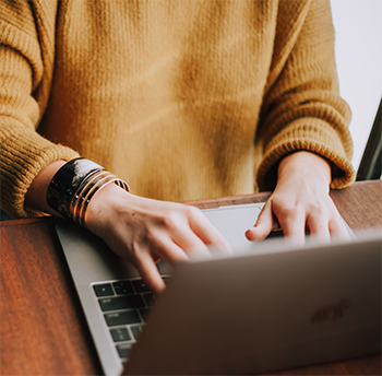 Woman typing on laptop