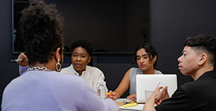 Diverse employees working together